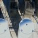 Bulk gas tanks and on-site nitrogen generation equipment cast long shadows on a sunny day.